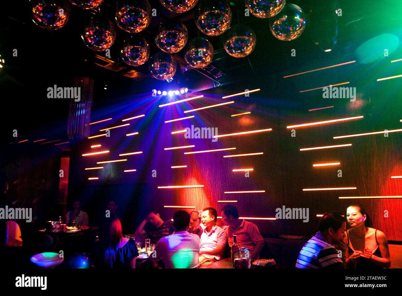 Young Vietnamese enjoy a night out inside Funky Buddha, a bar in the Old Quarter of Hanoi, Vietnam Stock Photo