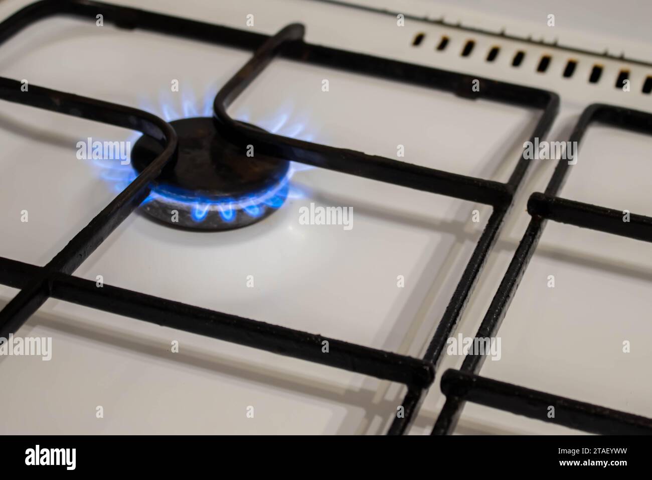 Woman turning on the gas burner on the stove Stock Photo Alamy