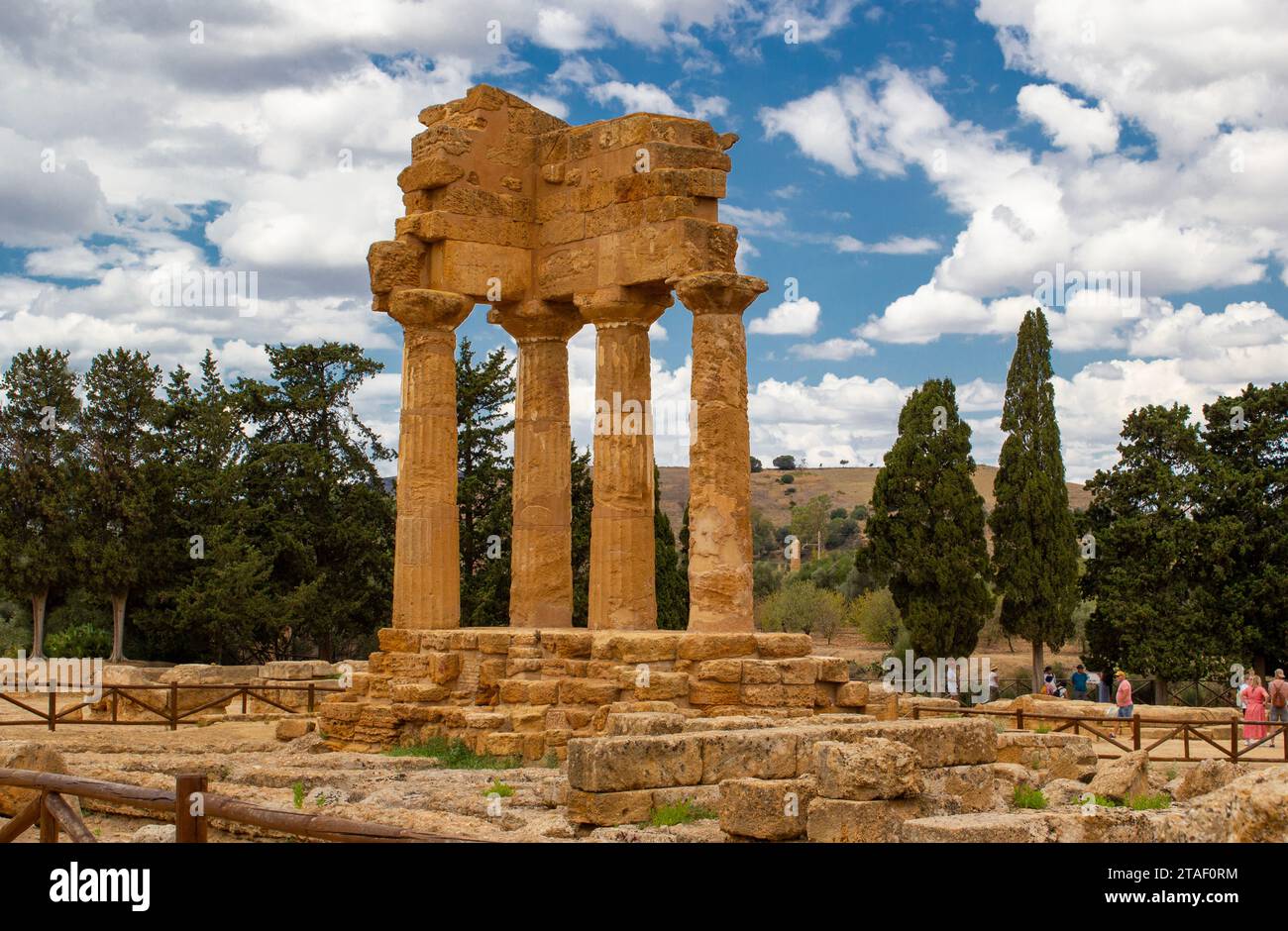 Dioscuri Temple. Daytime images of the Valley of the Temples in Agrigento, Sicily. Sunny day with clouds at noon. Greek archeological architecture Stock Photo