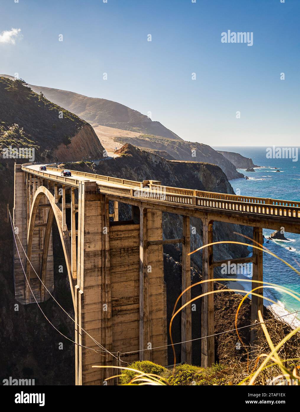 Scenic vertical view of Bixby Bridge on the pacific coast highway during a sunny fall day in Big Sur, California, United States Stock Photo
