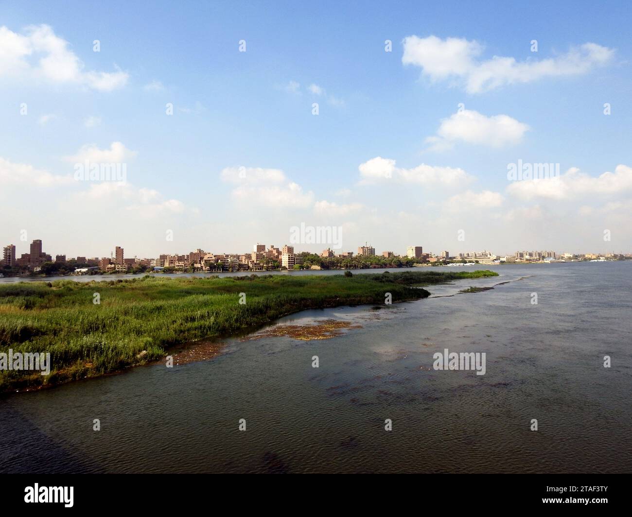 Giza, Egypt, September 9 2022: The Nile river in Egypt, with a village ...