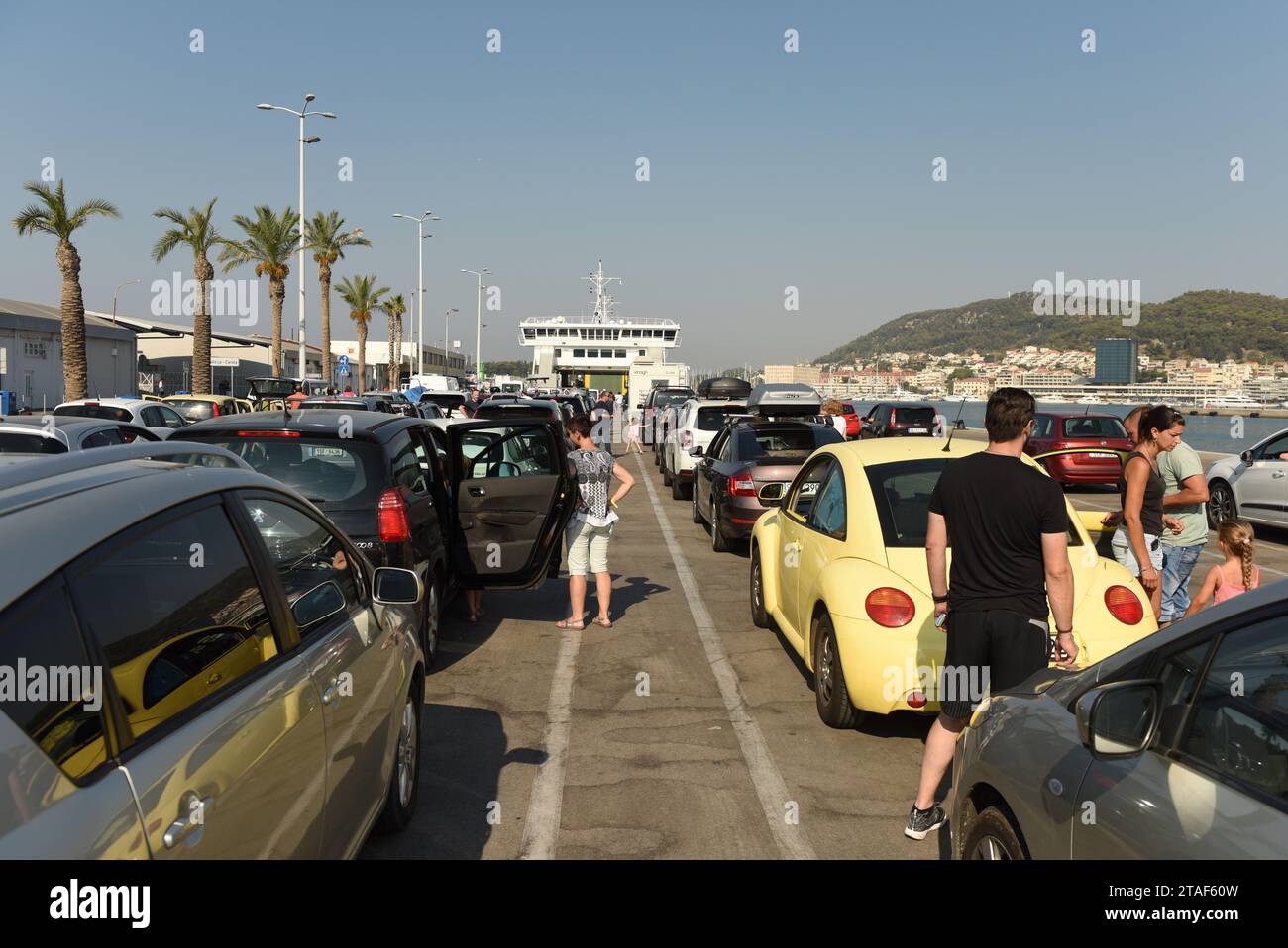 Split, Croatia - August 19, 2017: Cars waiting for ferry boarding in port of Split, Croatia. Stock Photo