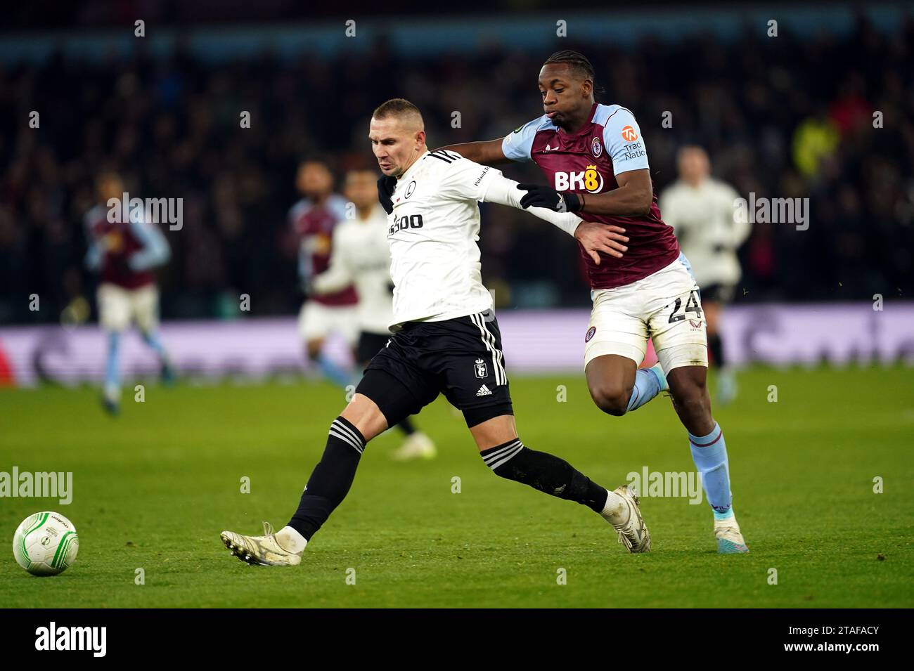 Legia Warsaw's Artur Jedrzejczyk and Aston Villa's Jhon Duran (right) battle for the ball during the UEFA Europa Conference League Group E match at Villa Park, Birmingham. Picture date: Thursday November 30, 2023. Stock Photo