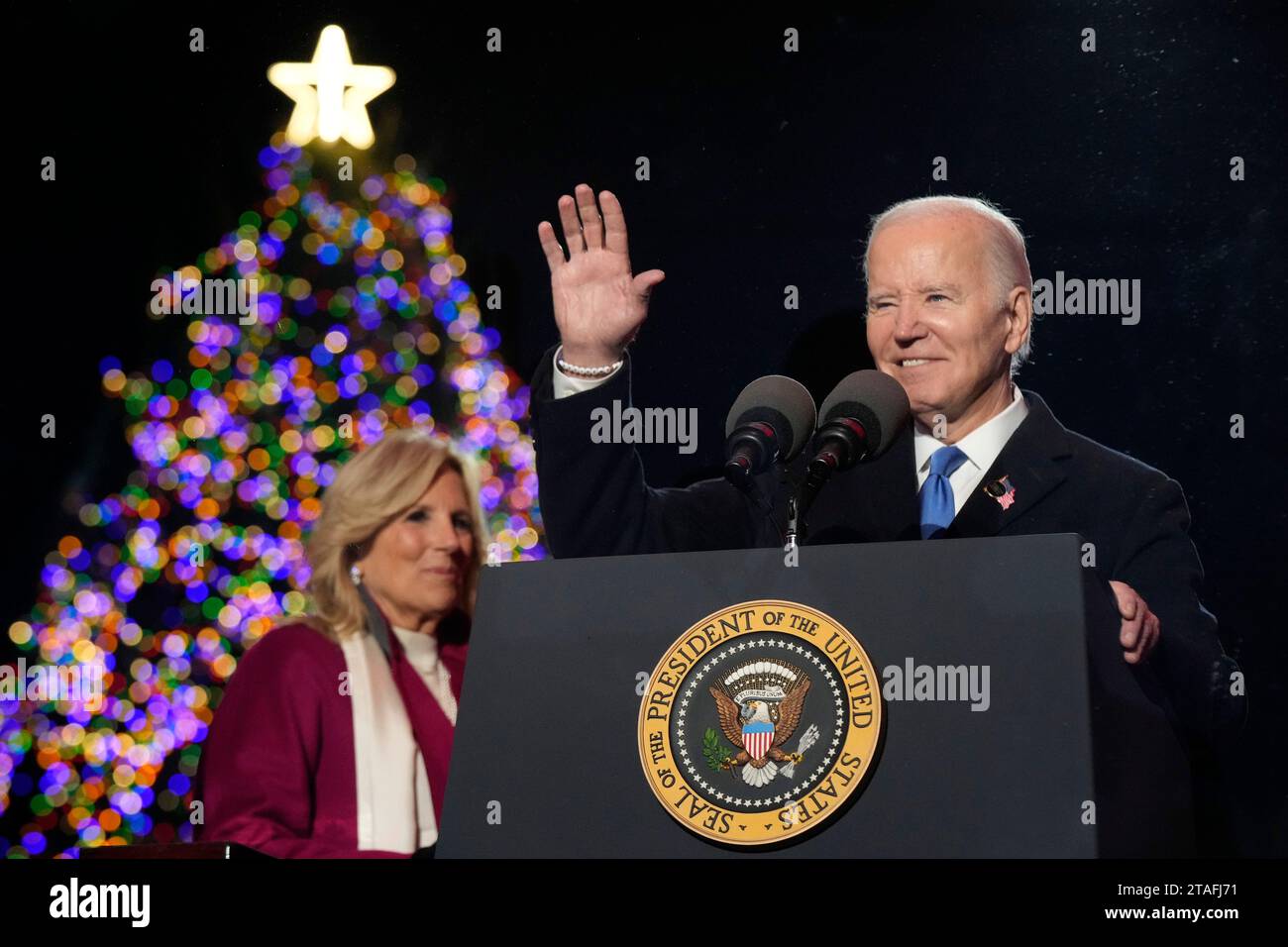 President Joe Biden and first lady Jill Biden, speak after lighting the