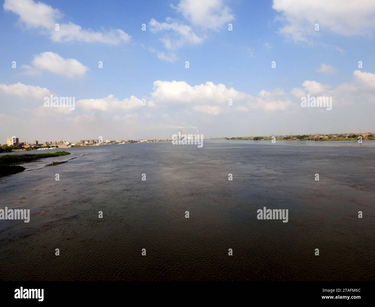 Giza, Egypt, September 9 2022: The Nile river in Egypt, with a village ...