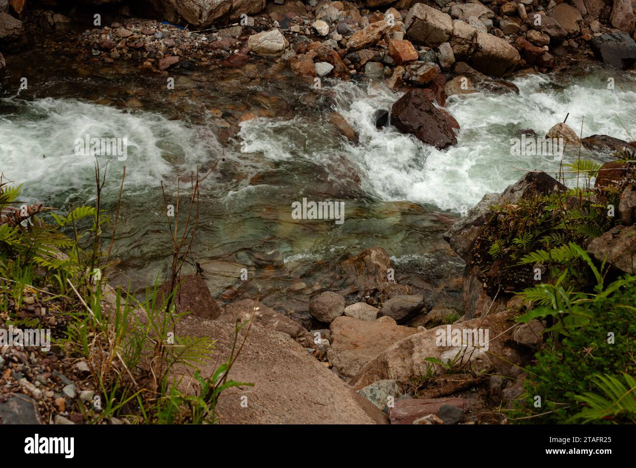 The flowing river in the highlands of Tembagapura, Papua, Indonesia Stock Photo