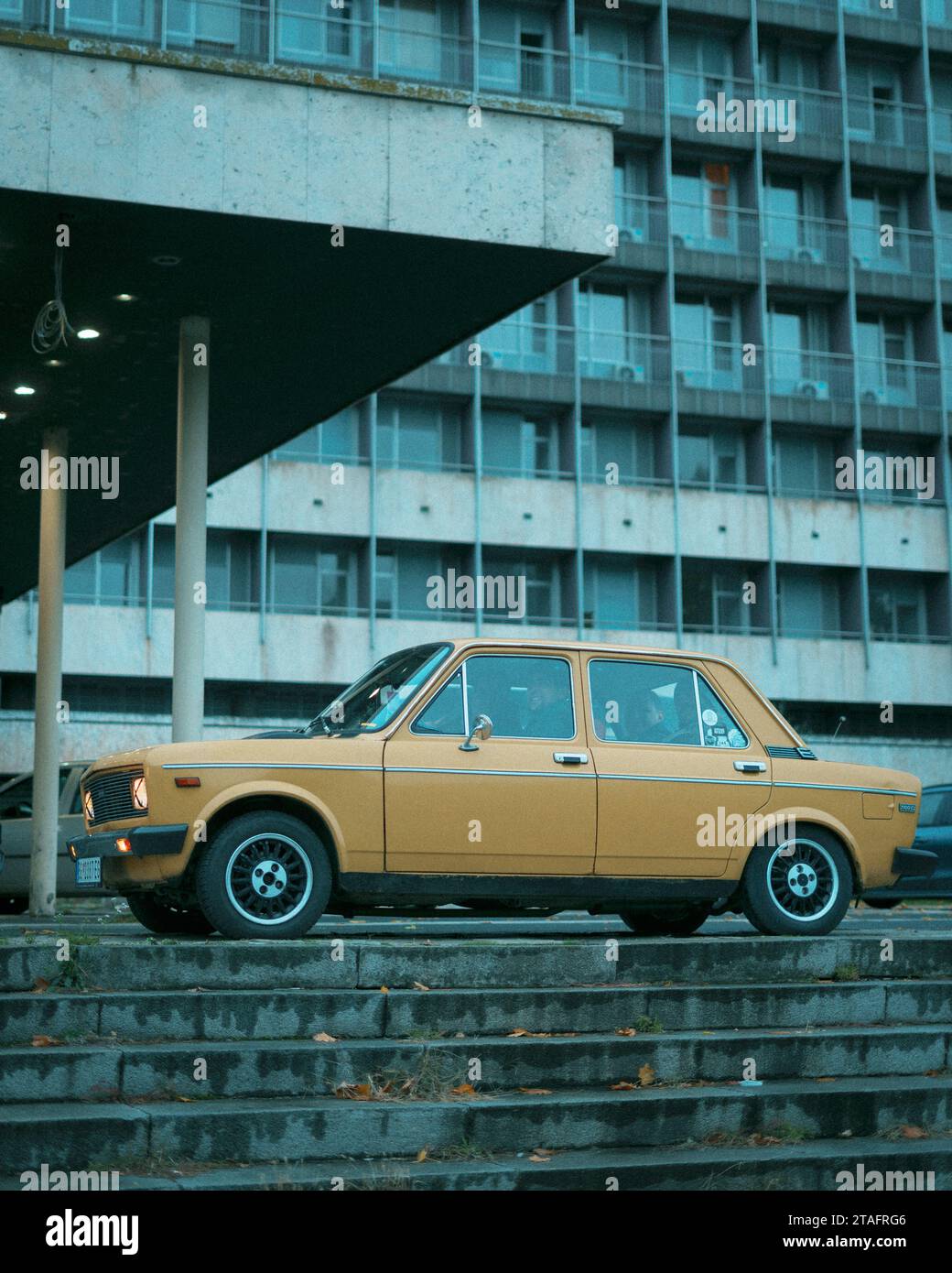 Vintage Yugo car parked outside the Hotel Jugoslavija, in Belgrade, Serbia Stock Photo