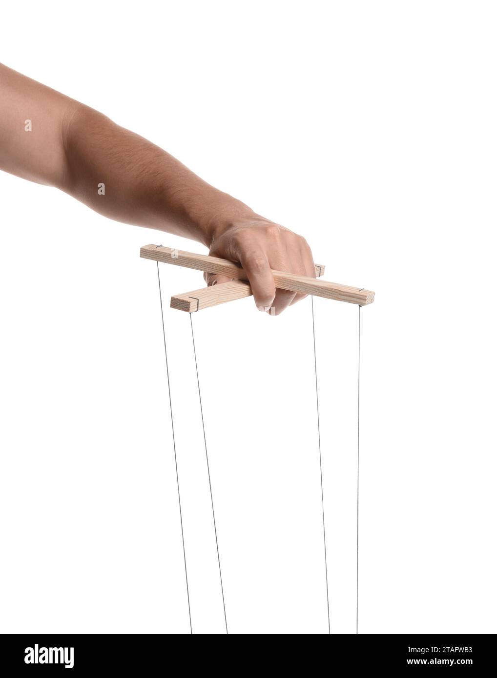 Man holding puppet control bar with strings on white background, closeup Stock Photo