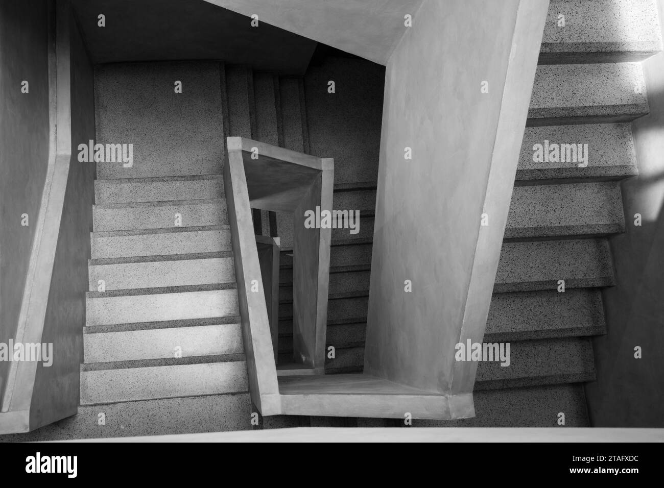 Black and white, Top diminishing perspective view of simple modern concrete staircase. Stock Photo