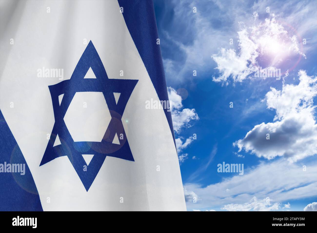 National flag of Israel against blue sky with clouds Stock Photo - Alamy