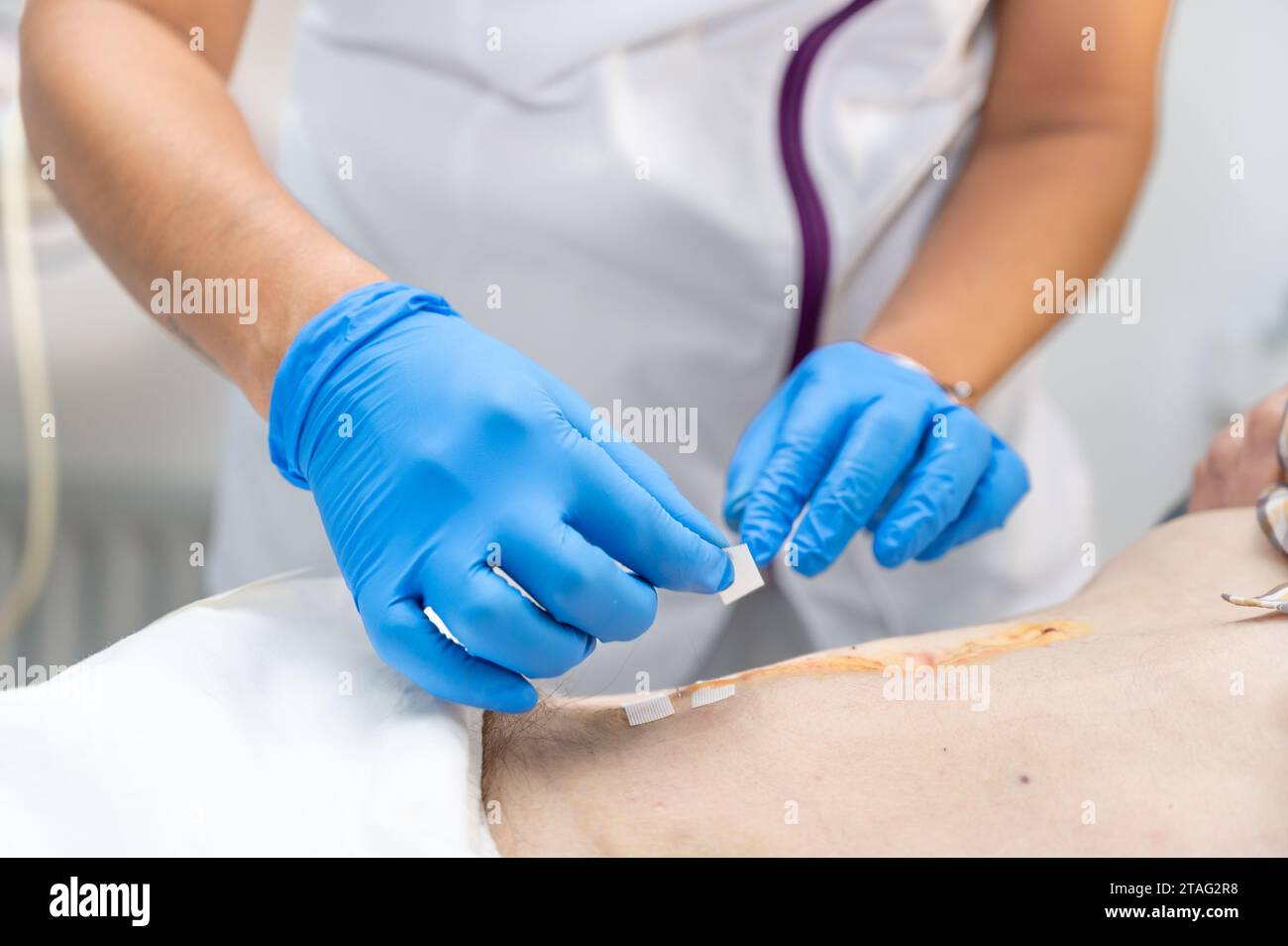 hand of Doctor is using clean cotton dressing infection wound at a man