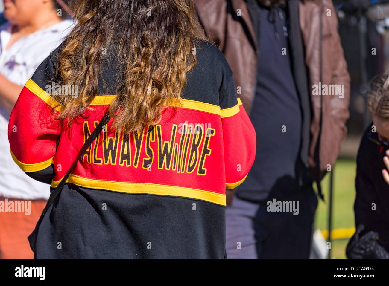 First Nations indigenous Aboriginal woman wearing a 'Always will be' sweater at the Sorry Day event in Sydney during National Reconciliation Week Stock Photo