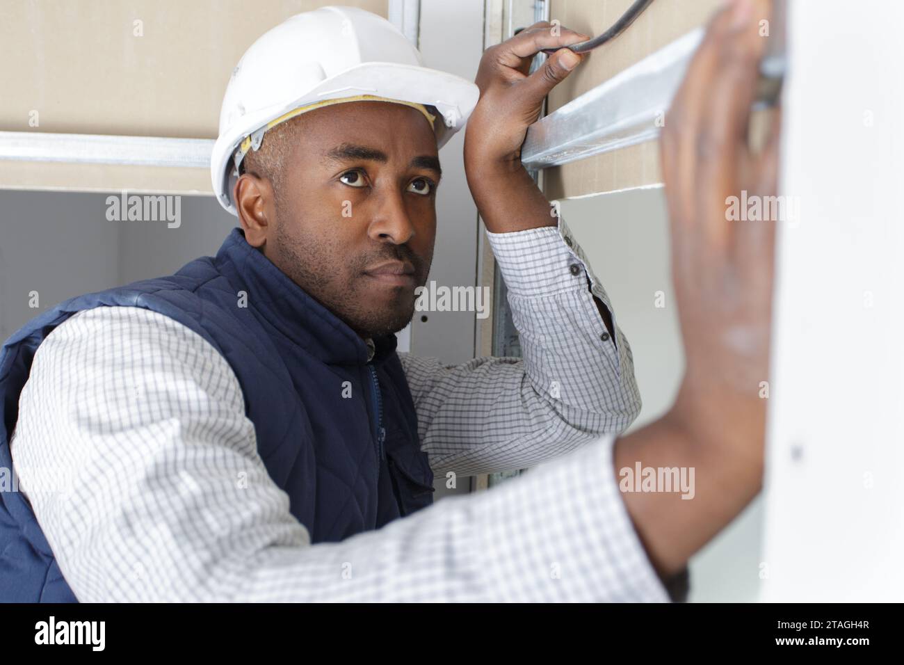 service man measuring window for installation indoors Stock Photo - Alamy