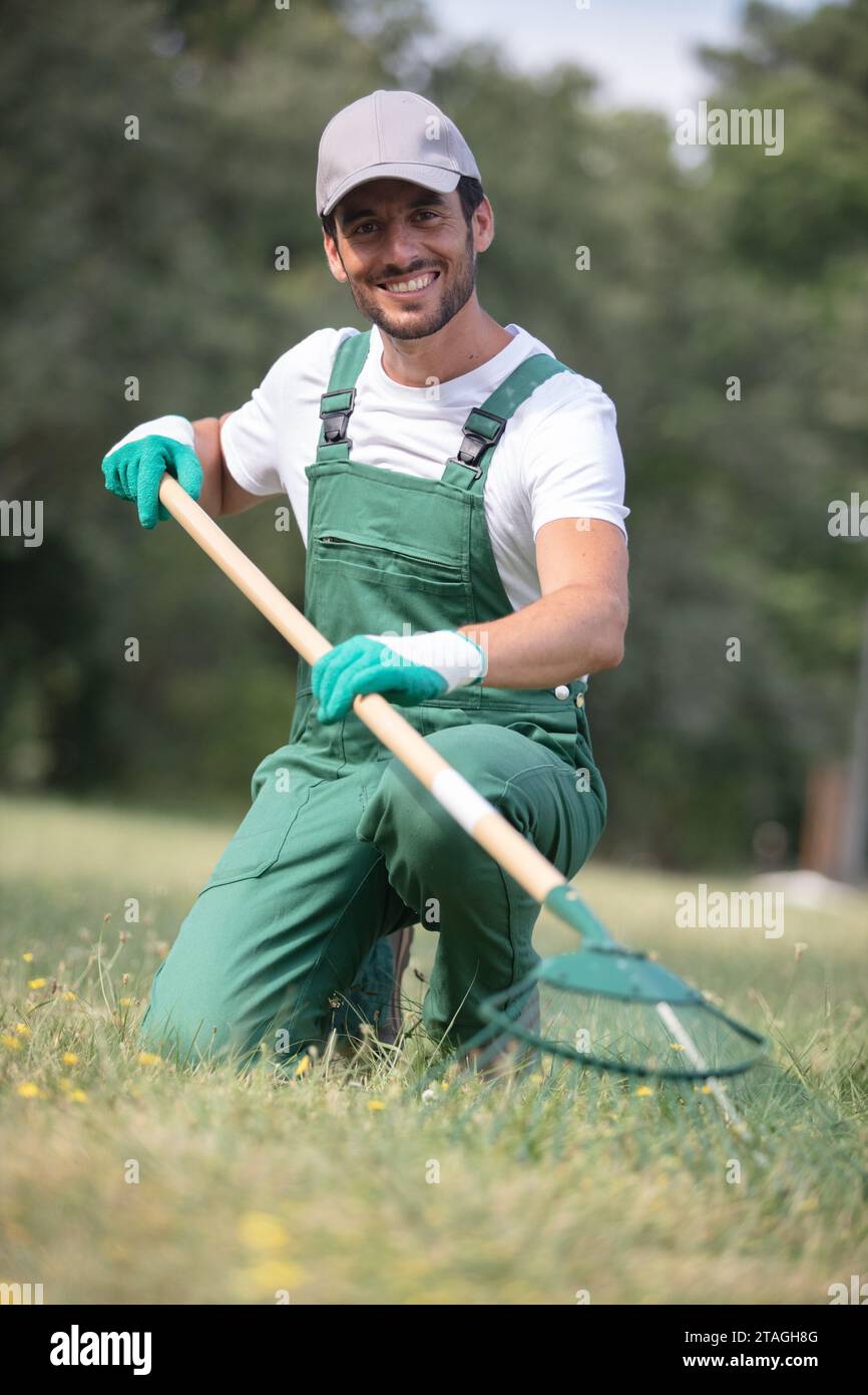 Man standing in grass rake hi-res stock photography and images - Alamy