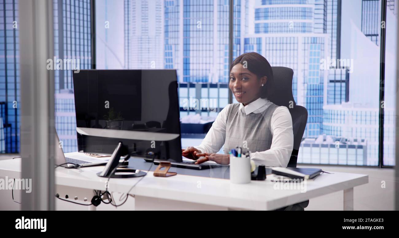 African woman using computer for business communication Stock Photo