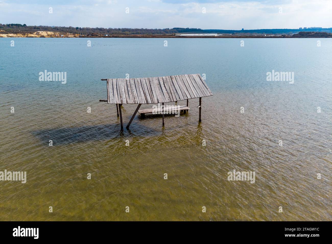 Rising water level on a lake with a flooded shore, aerial view Stock Photo