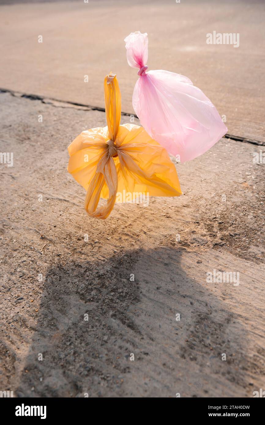 Used plastic bags floating in the air and sky, garbage and pollution, global warming and climate change. Stock Photo