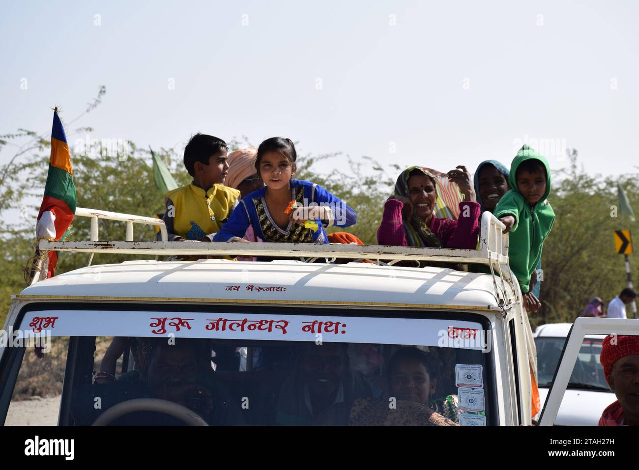 Indian people on a truck on the road to Jodhpur, Rajasthan - India Stock Photo