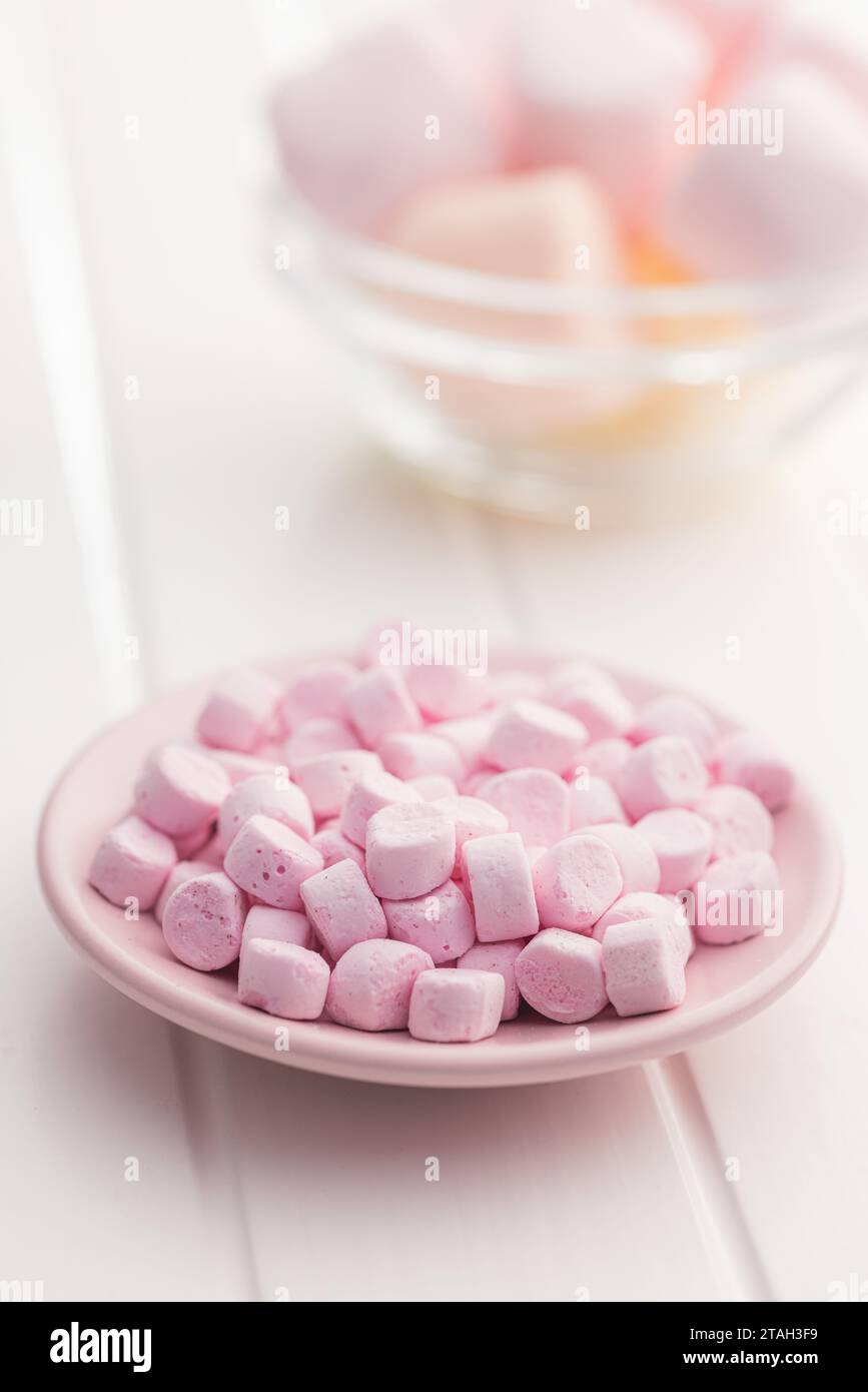 Mini sweet marshmallows candy on the plate. Stock Photo