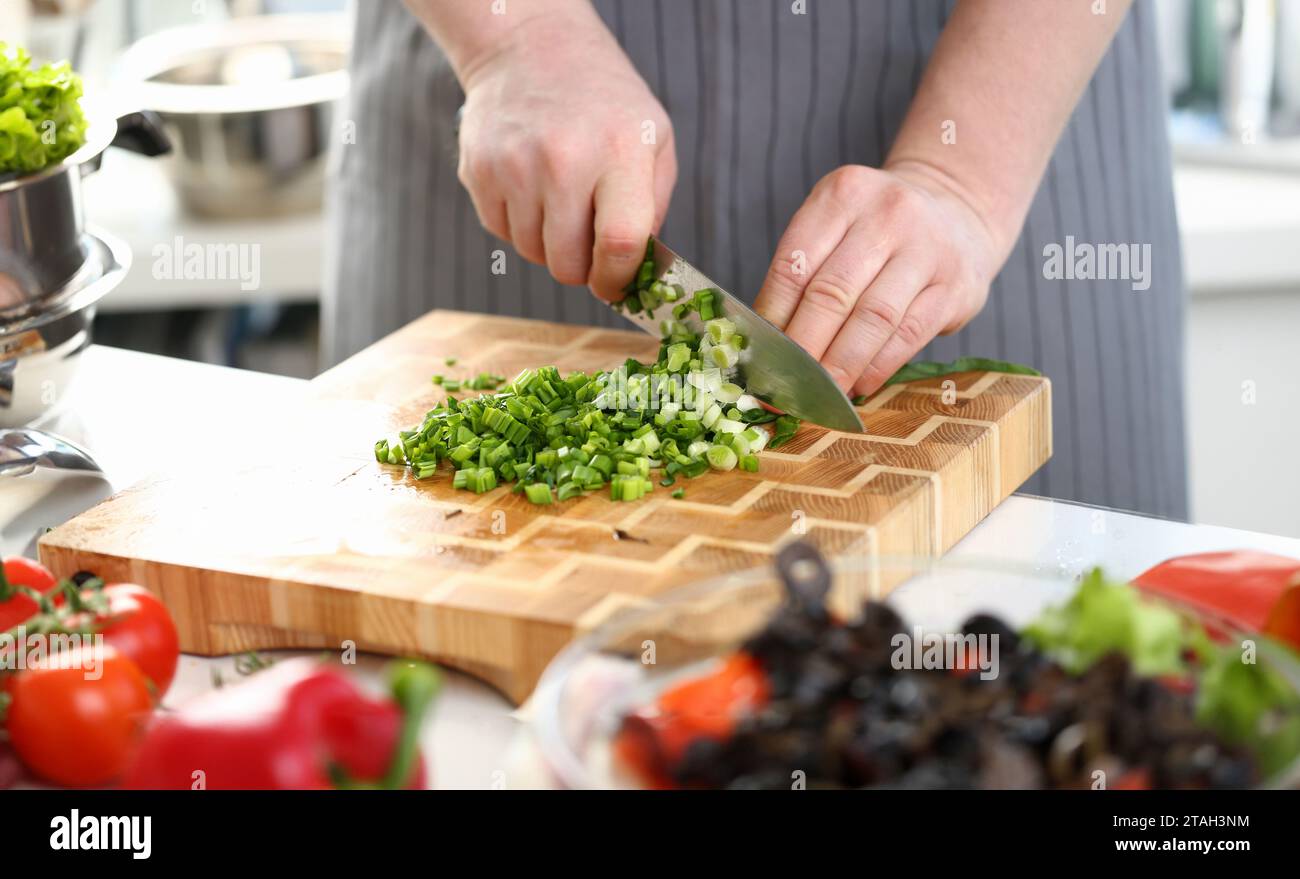 Chef cutting spring onions knife hi-res stock photography and images ...