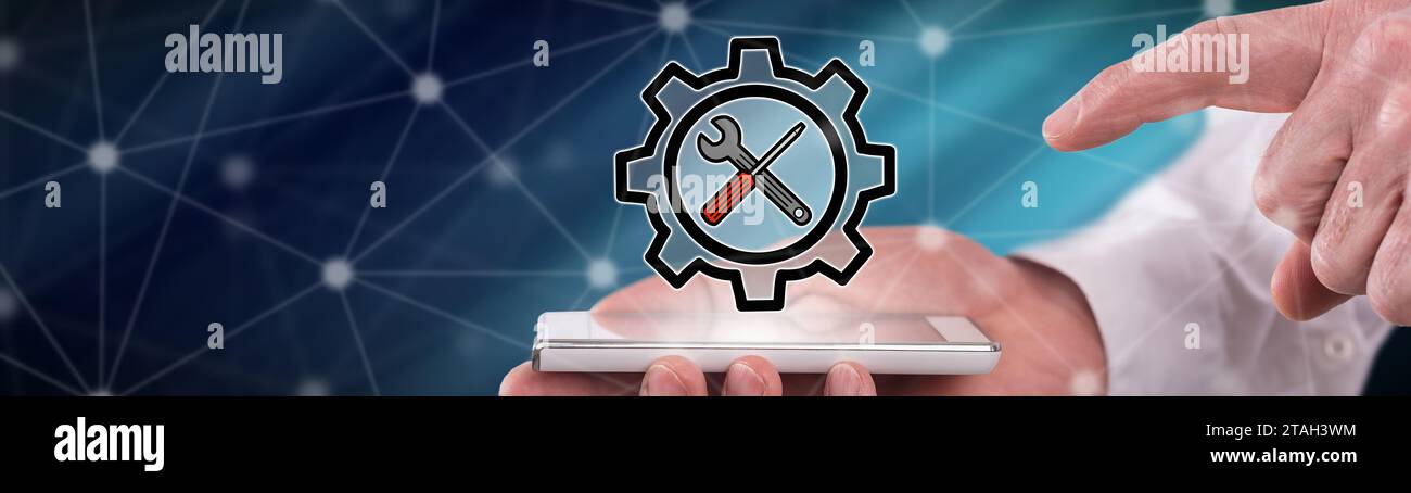 Settings concept above a smartphone held by a man Stock Photo