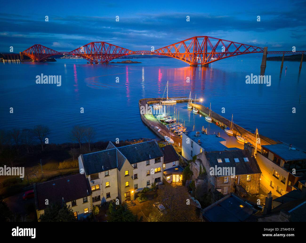 Aerial. View from drone at night of South Queensferry harbour and Forth Bridge in West Lothian