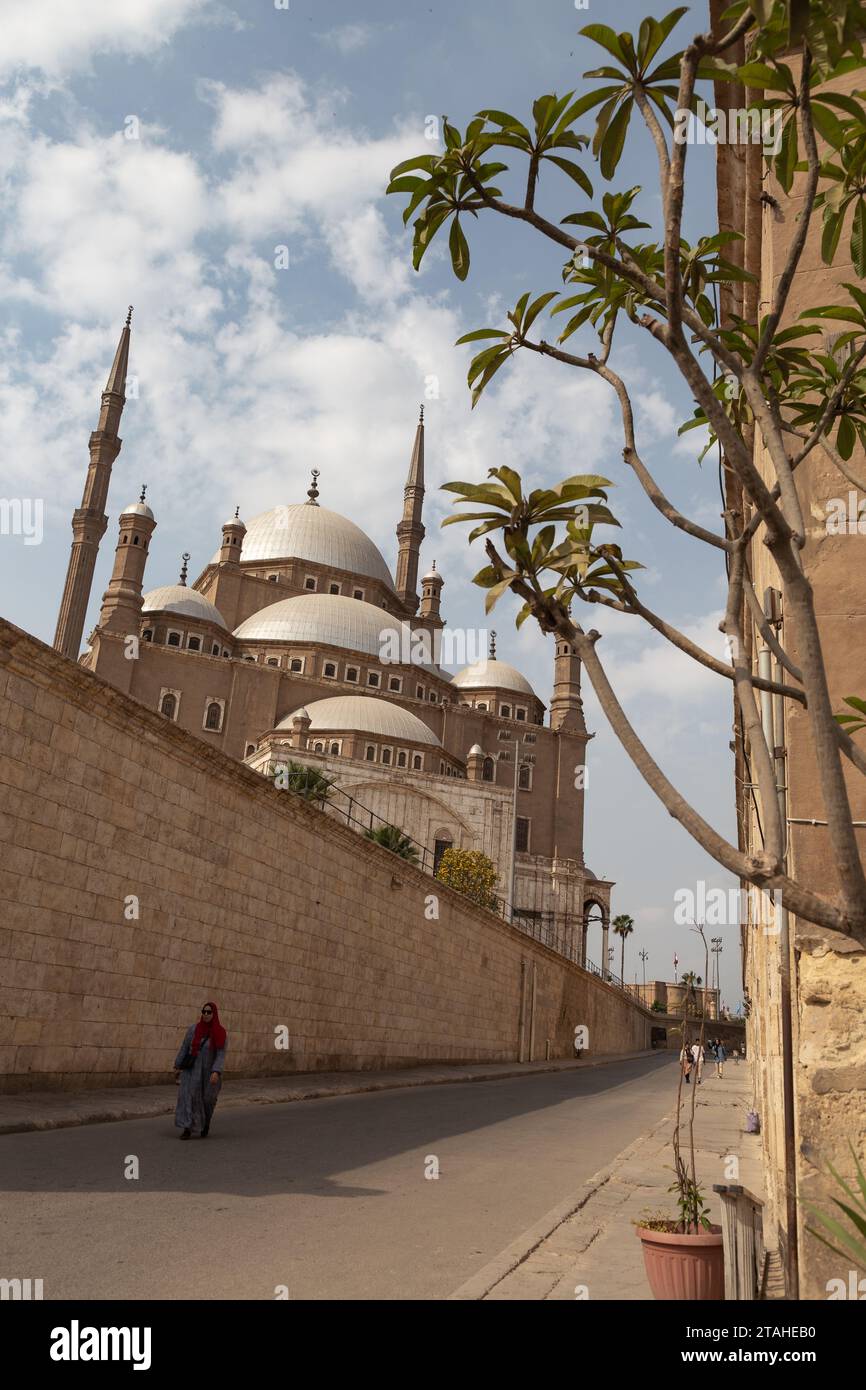 Muslim woman walking around the Citadel and Muhammad Ali mosque Stock Photo