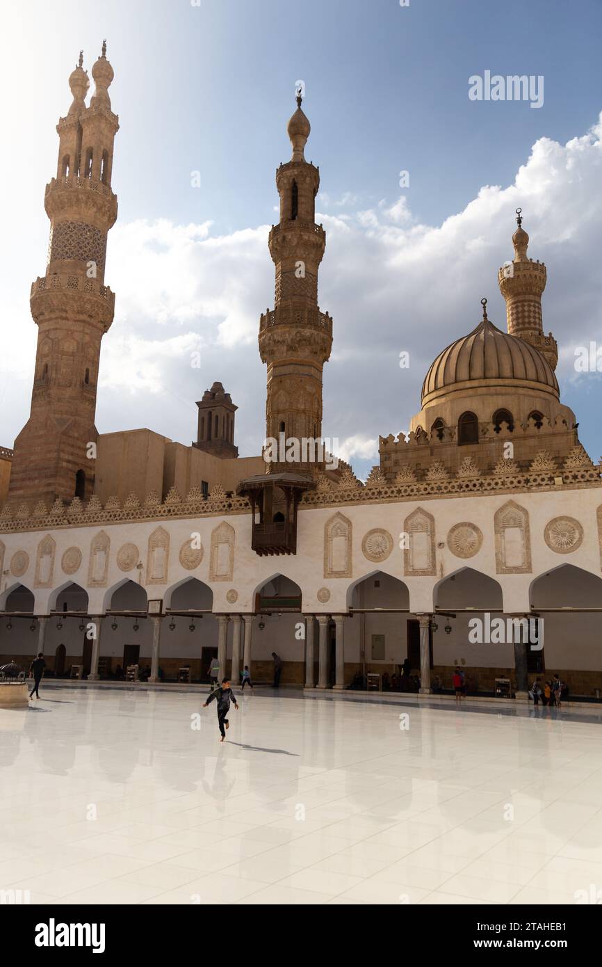 Kid running inside the Azhar Mosque in Old Cairo, Egypt Stock Photo