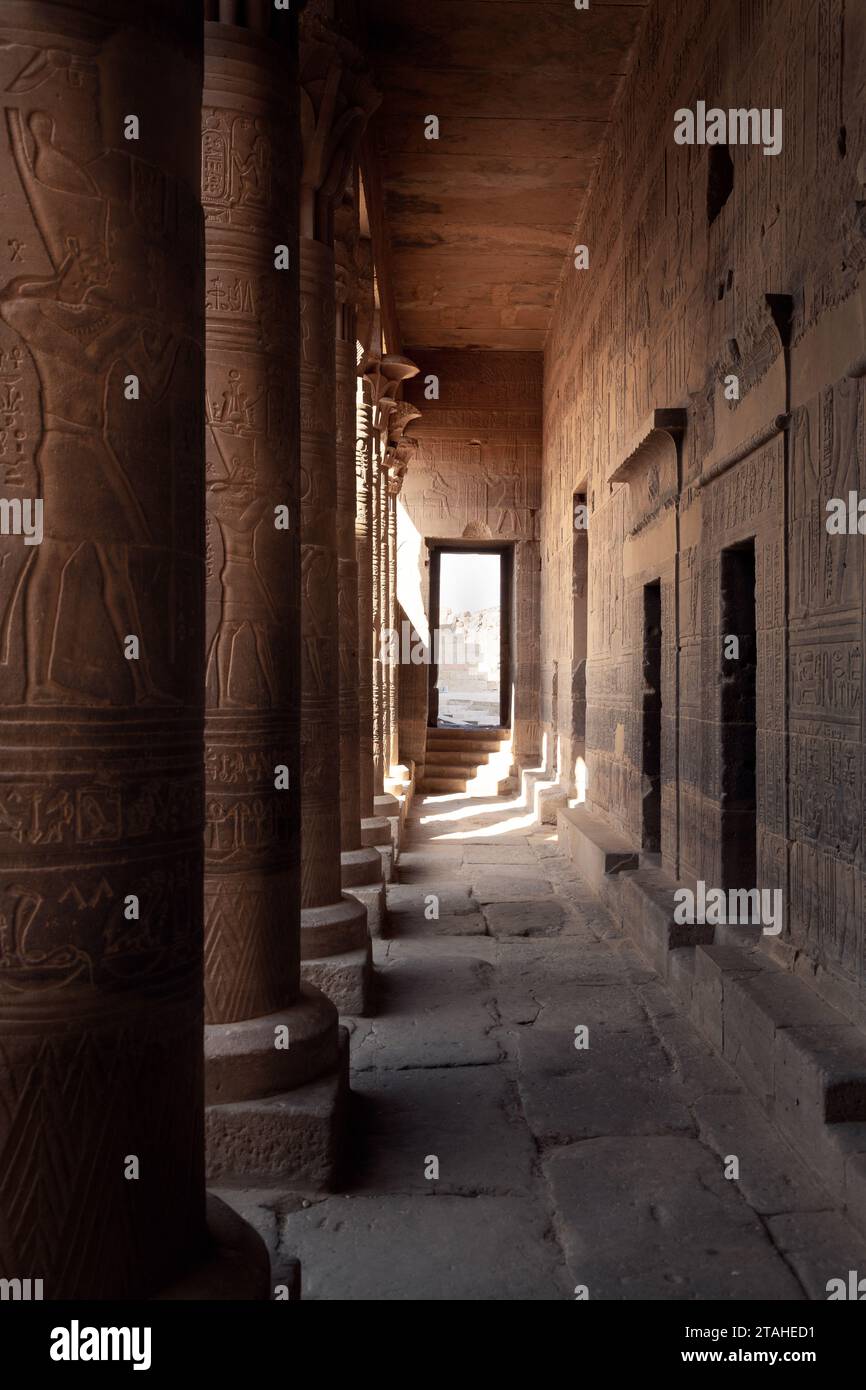 Columns covered with egyptian hieroglyphs in the Philae Temple Stock Photo