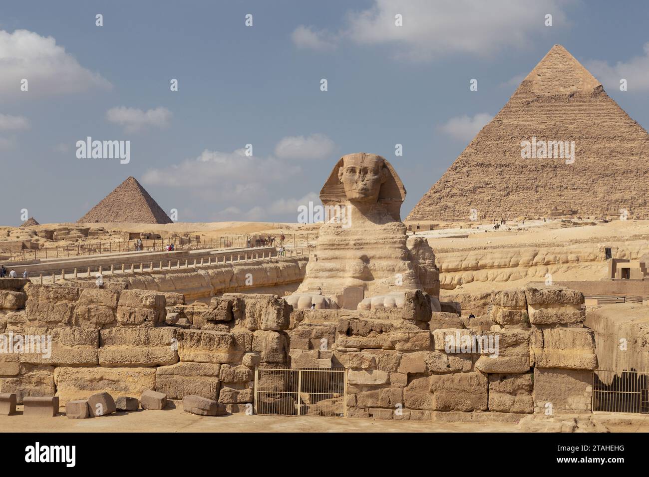 The Great Sphinx of Gyza with pyramid behind during sunny day Stock Photo