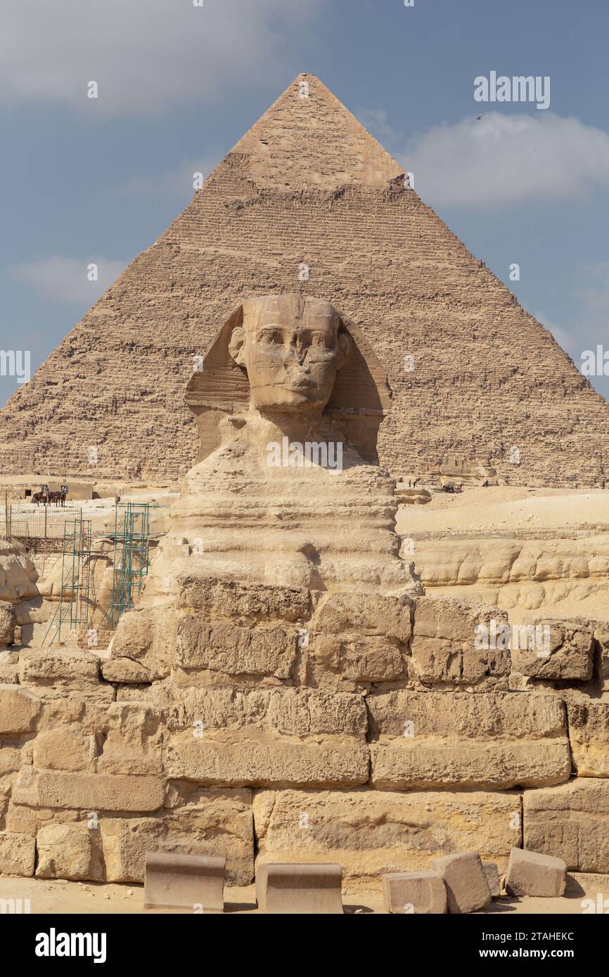 The Great Sphinx of Gyza with pyramid behind during sunny day Stock Photo