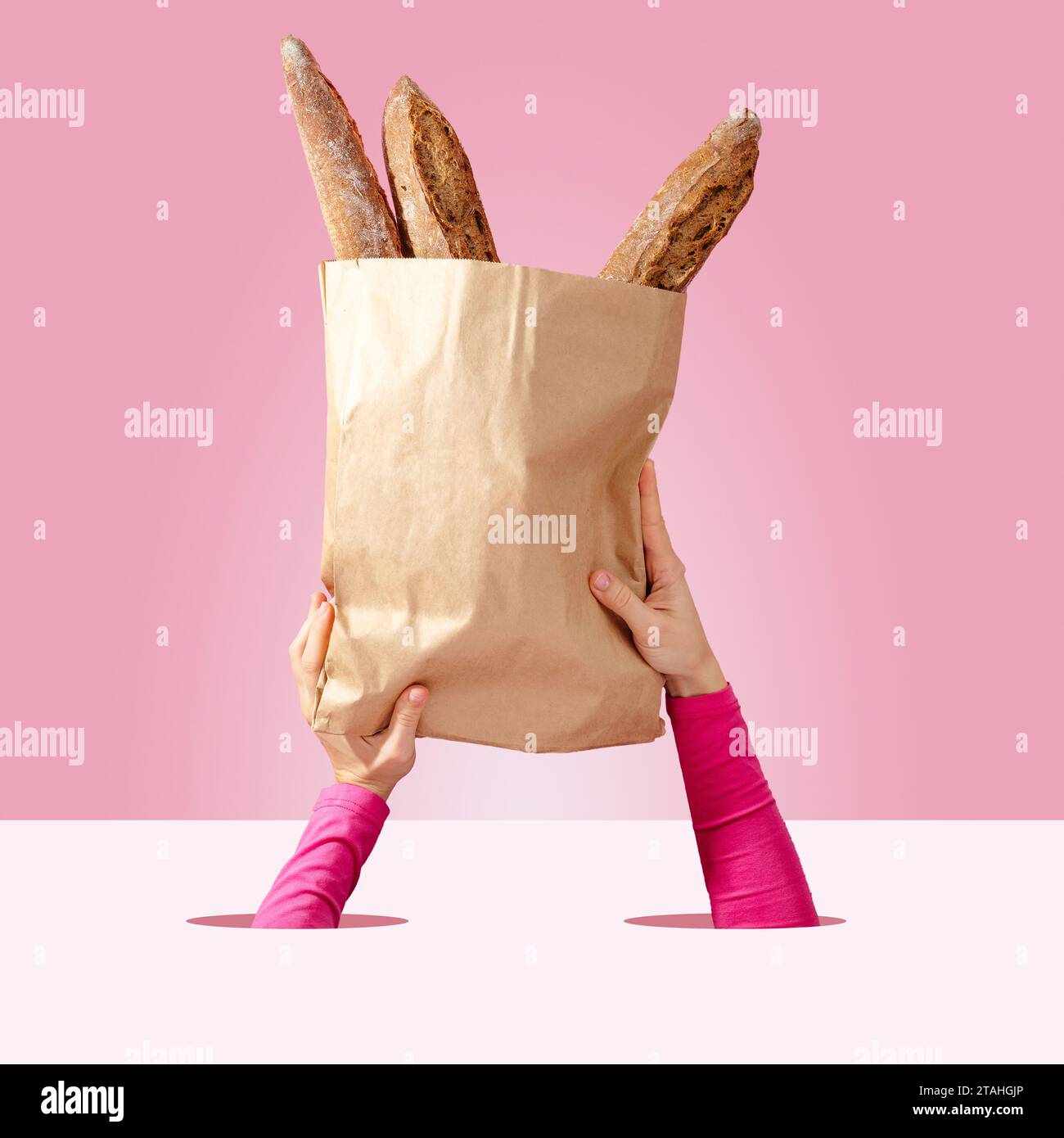 women's hands hold a paper bag with French baguettes Stock Photo - Alamy