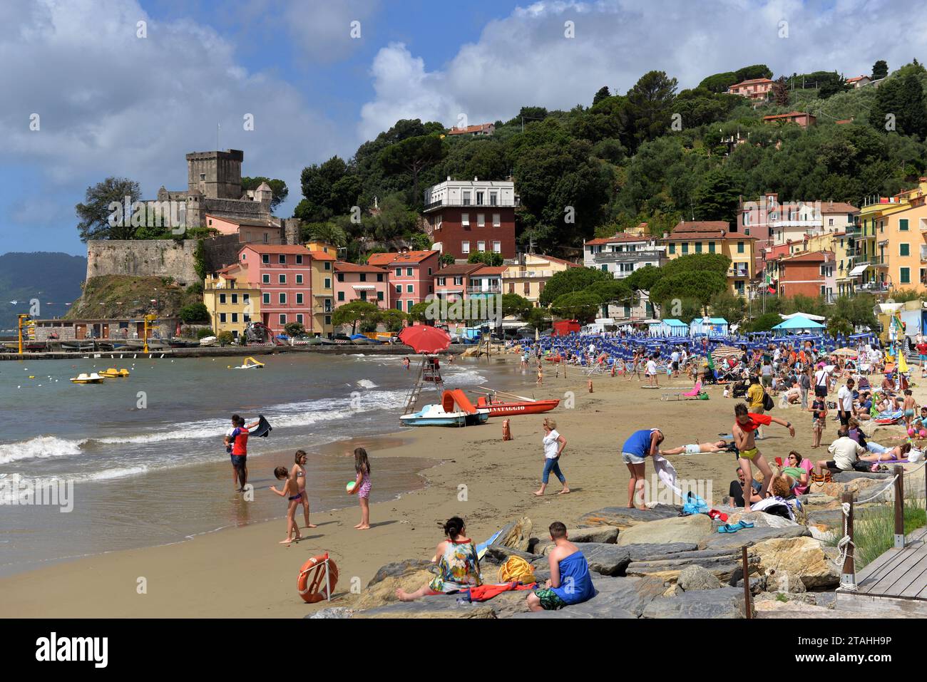 SAN TERENZO, LERICI, ITALY - JUNE 16, 2016: San Terenzo (St. Terenzo) beach crowded with bathers people in a June day. Stock Photo
