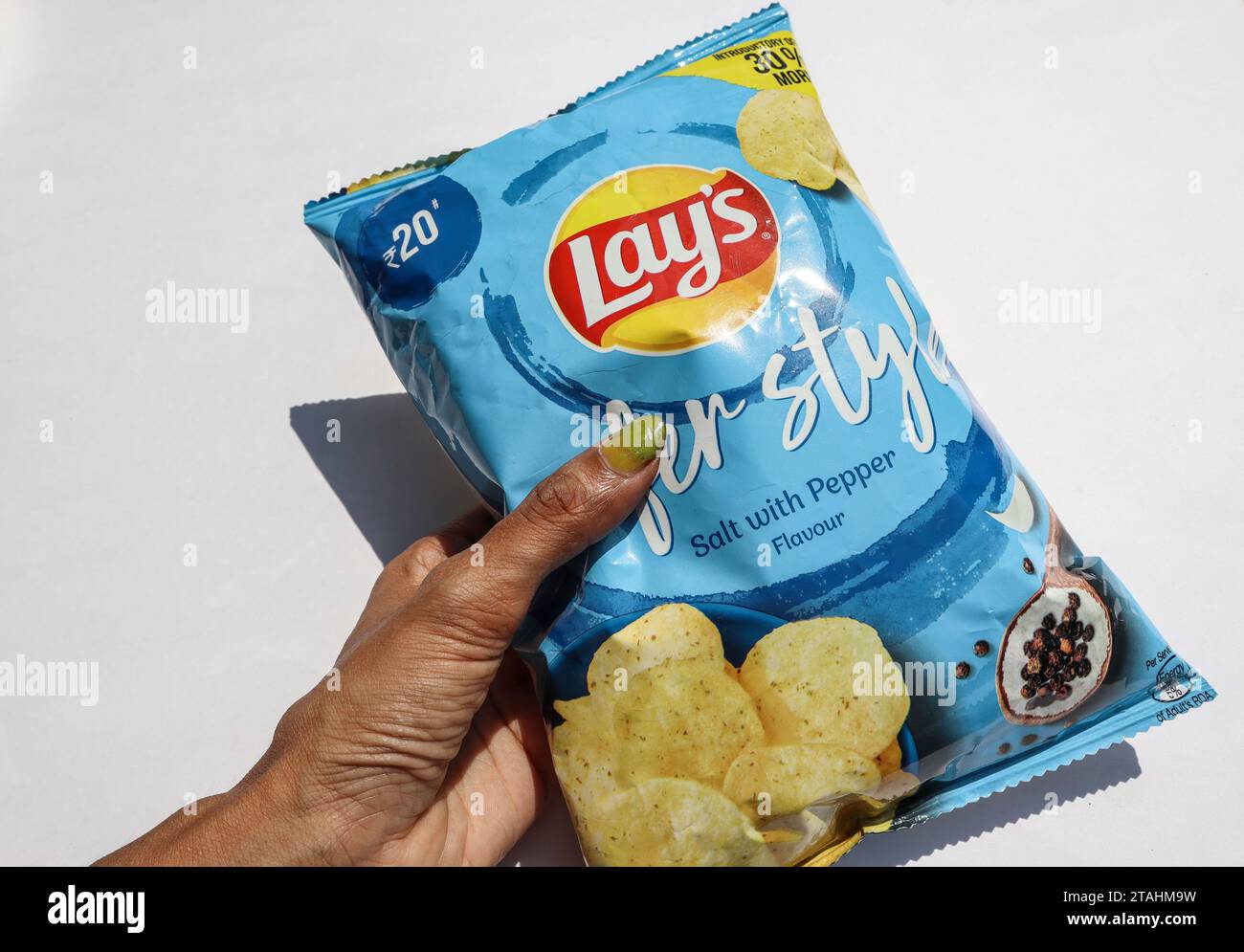 Lays chips in light blue packet. Lay's potato wafers of salt and pepper