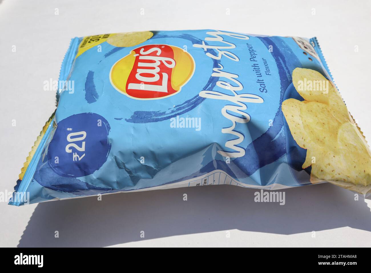 Lays chips in light blue packet. Lay's potato wafers of salt and pepper