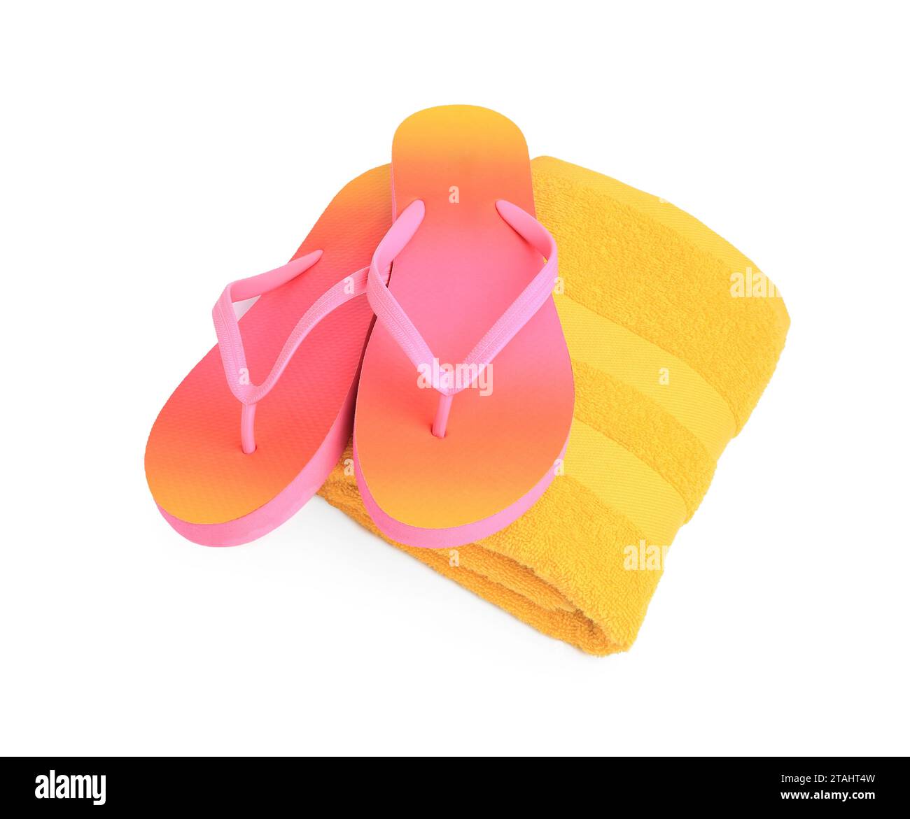 Yellow terry towel and flip flops isolated on white. Beach objects ...