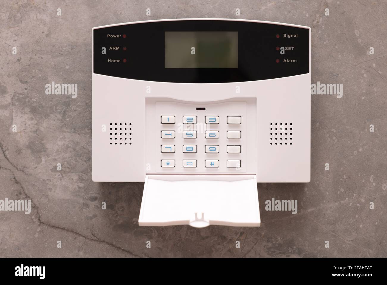 Home security alarm system on grey wall Stock Photo