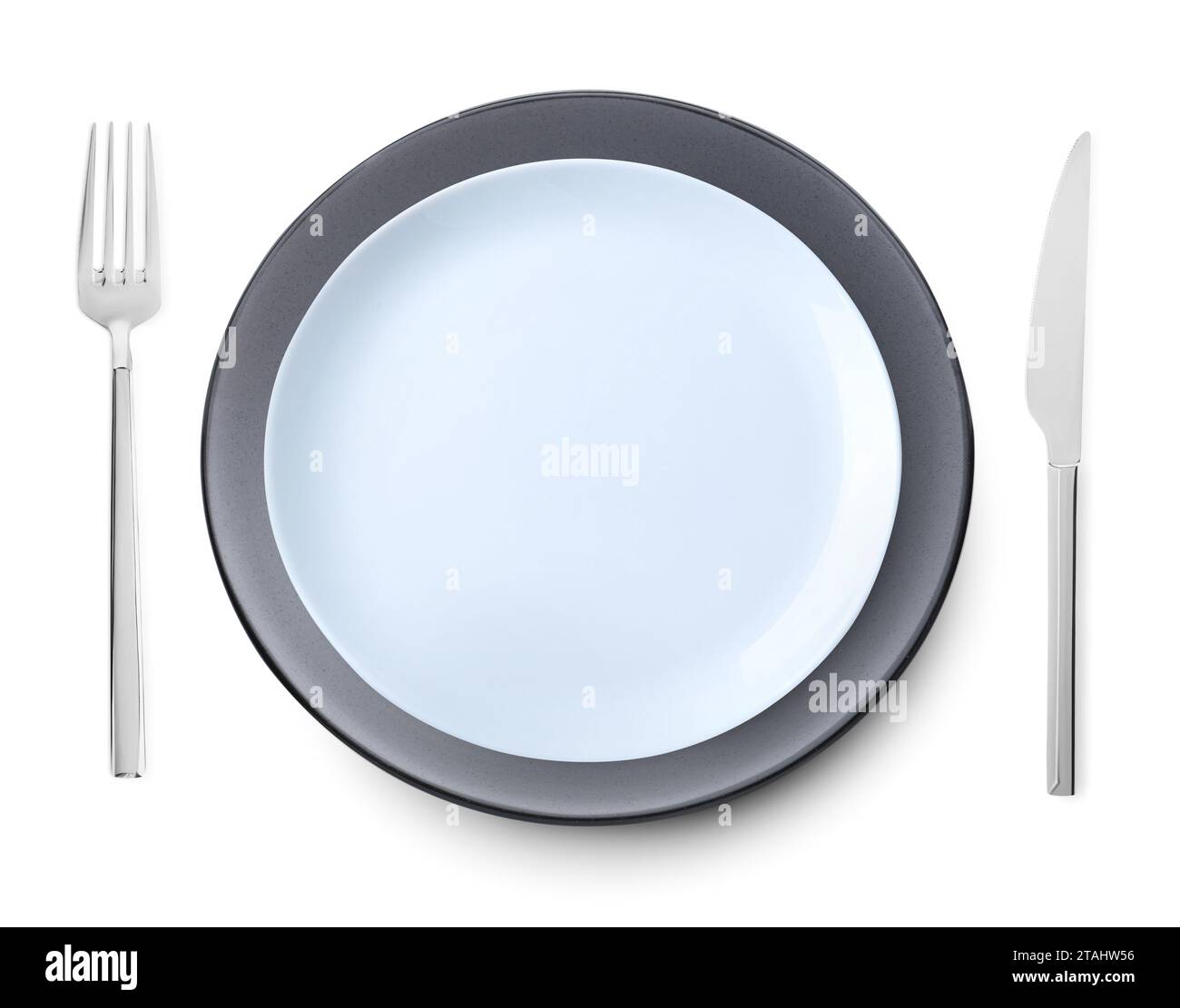 Clean plates, fork and knife on white background, top view Stock Photo ...