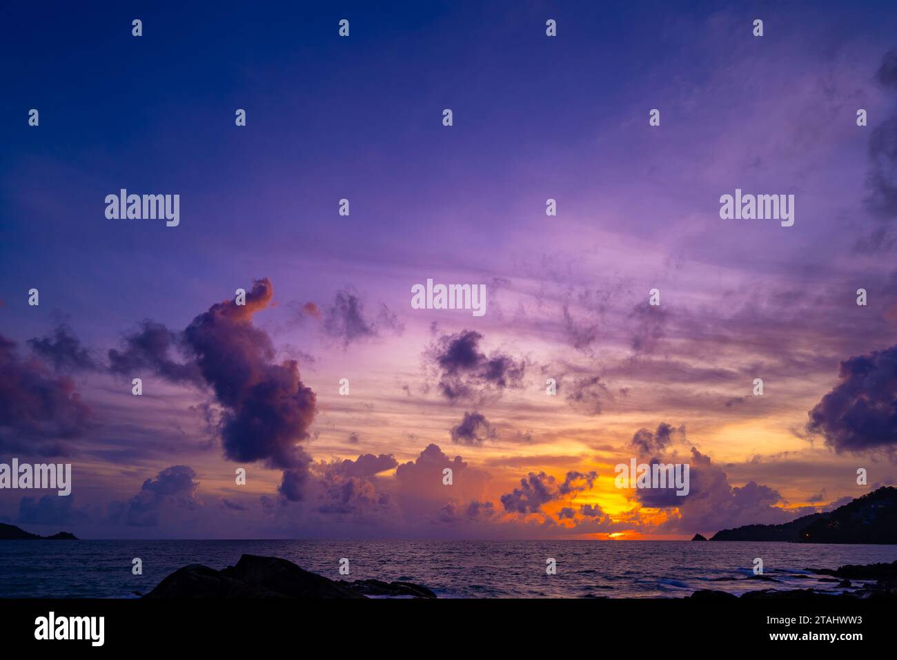 Beautiful colorful sunset or sunrise sky over sea with dramatic clouds ...
