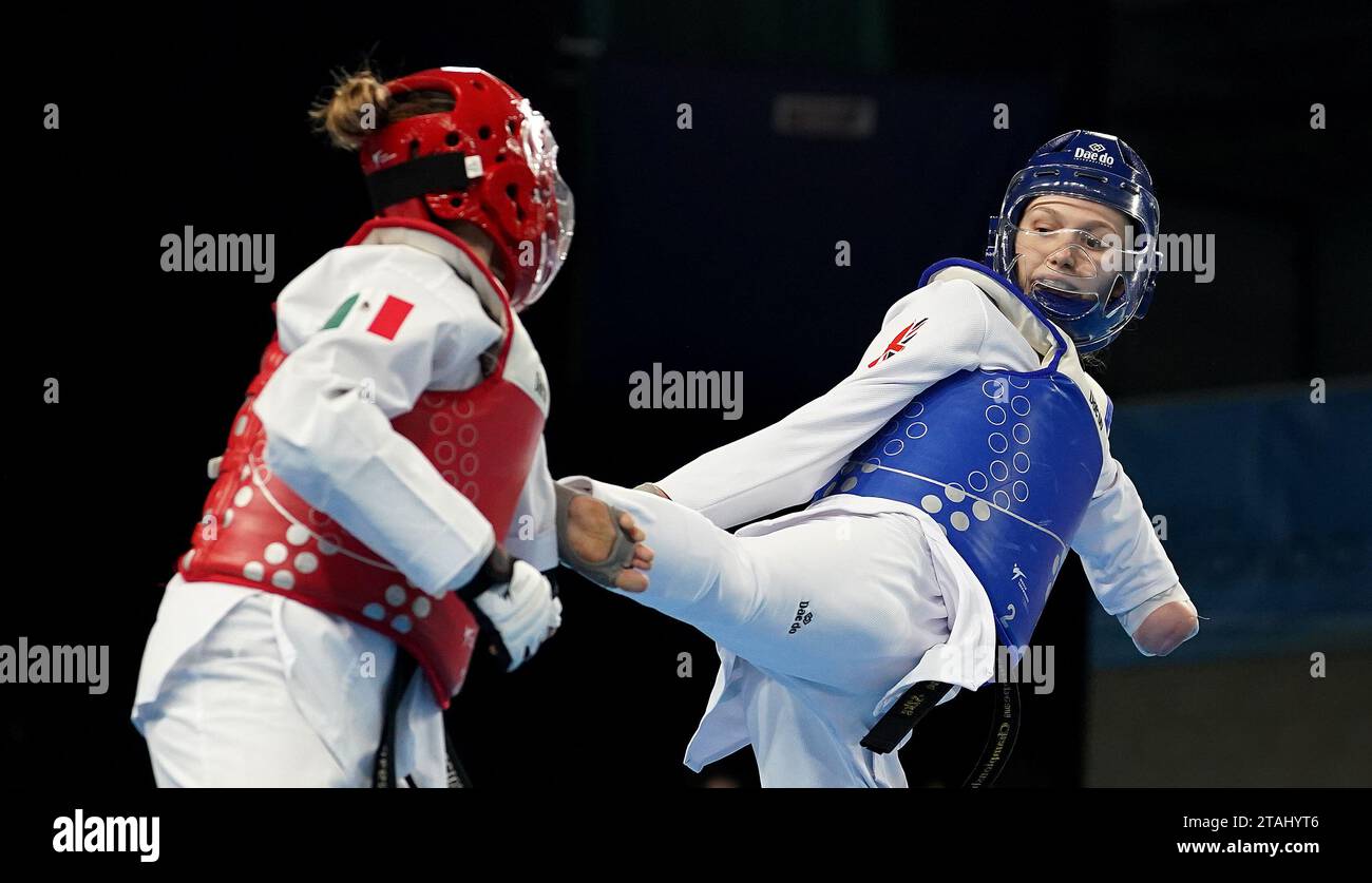 Great Britain's Keira Forsythe (right) in action during her first round match against Mexico's Quijano Garcia on day one of the 2023 World Taekwondo Grand Prix Final at the Manchester Regional Arena, Manchester. Picture date: Friday December 1, 2023. Stock Photo