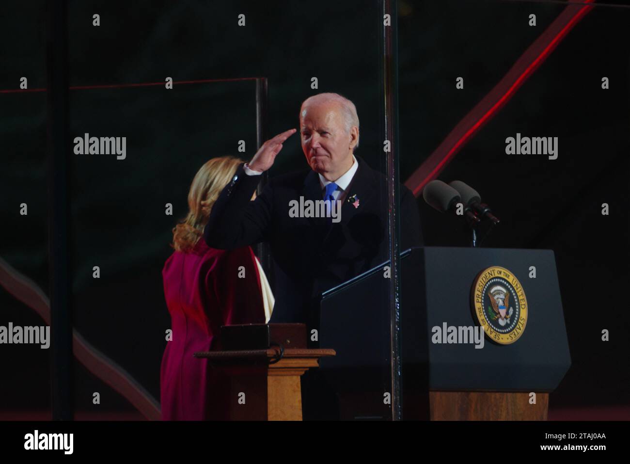 Washington, DC, USA. 30 Nov 2023. U.S. President Joe Biden salutes the Coast Guard band at the lighting of the National Christmas Tree. Stock Photo