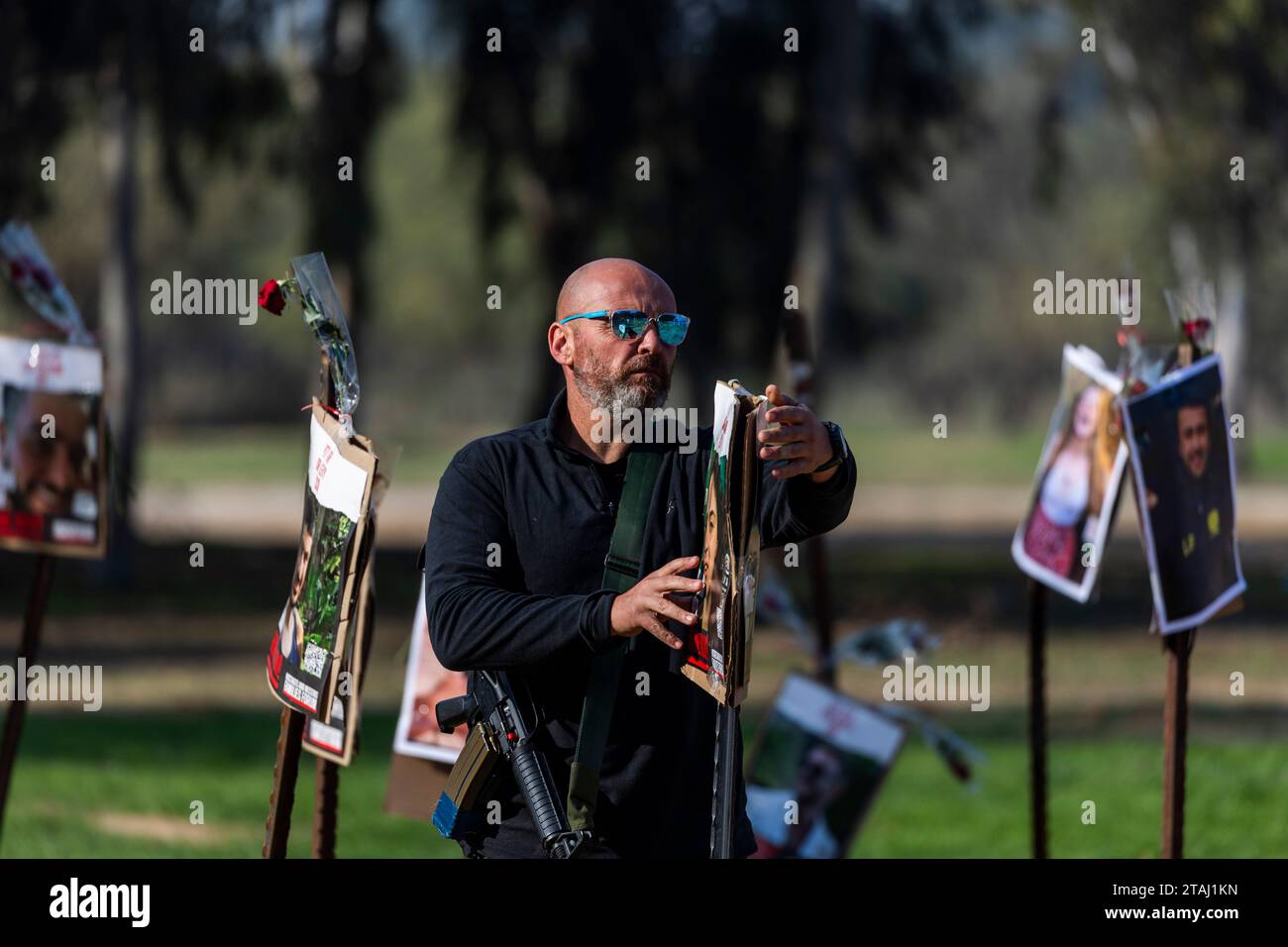 01 December 2023, Israel, Re'im An Israeli soldier stands between the