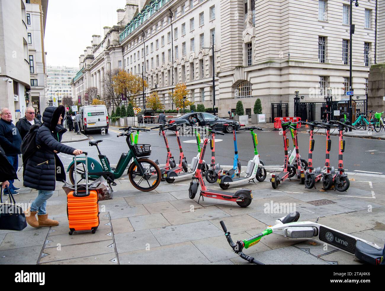 London, UK. 27th November, 2023. Lime and Eoi escooters for hire near