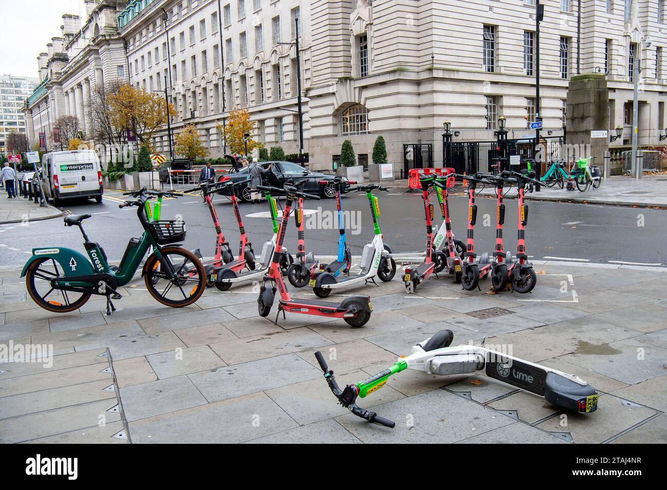 London, UK. 27th November, 2023. Lime and Eoi escooters for hire near