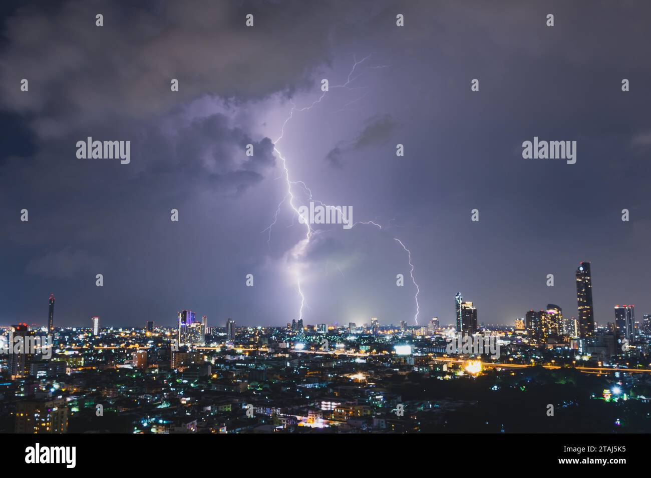 Lightning storm over night city Stock Photo - Alamy