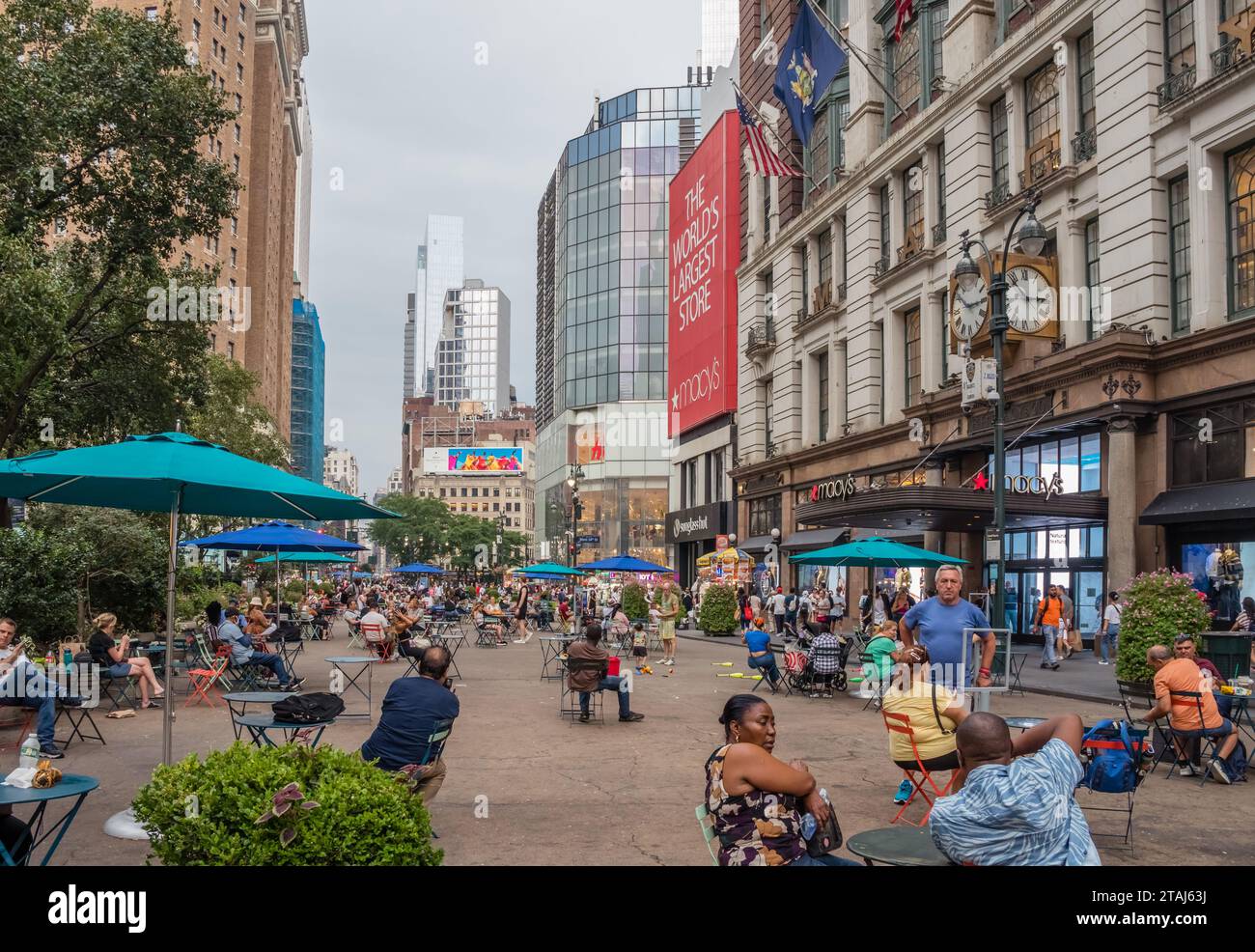 New York, NY, US-September 8, 2023: Tourists and NY residents in Herald Square, a public park in mid-town Manhattan on a warm day. Stock Photo