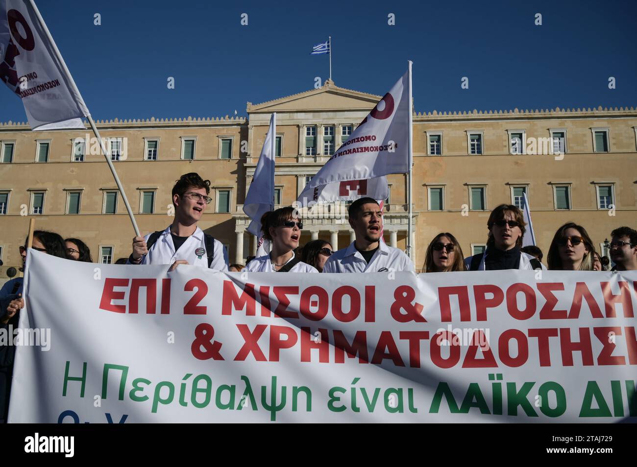 Striking hospital doctors shout slogans during a protest demanding ...