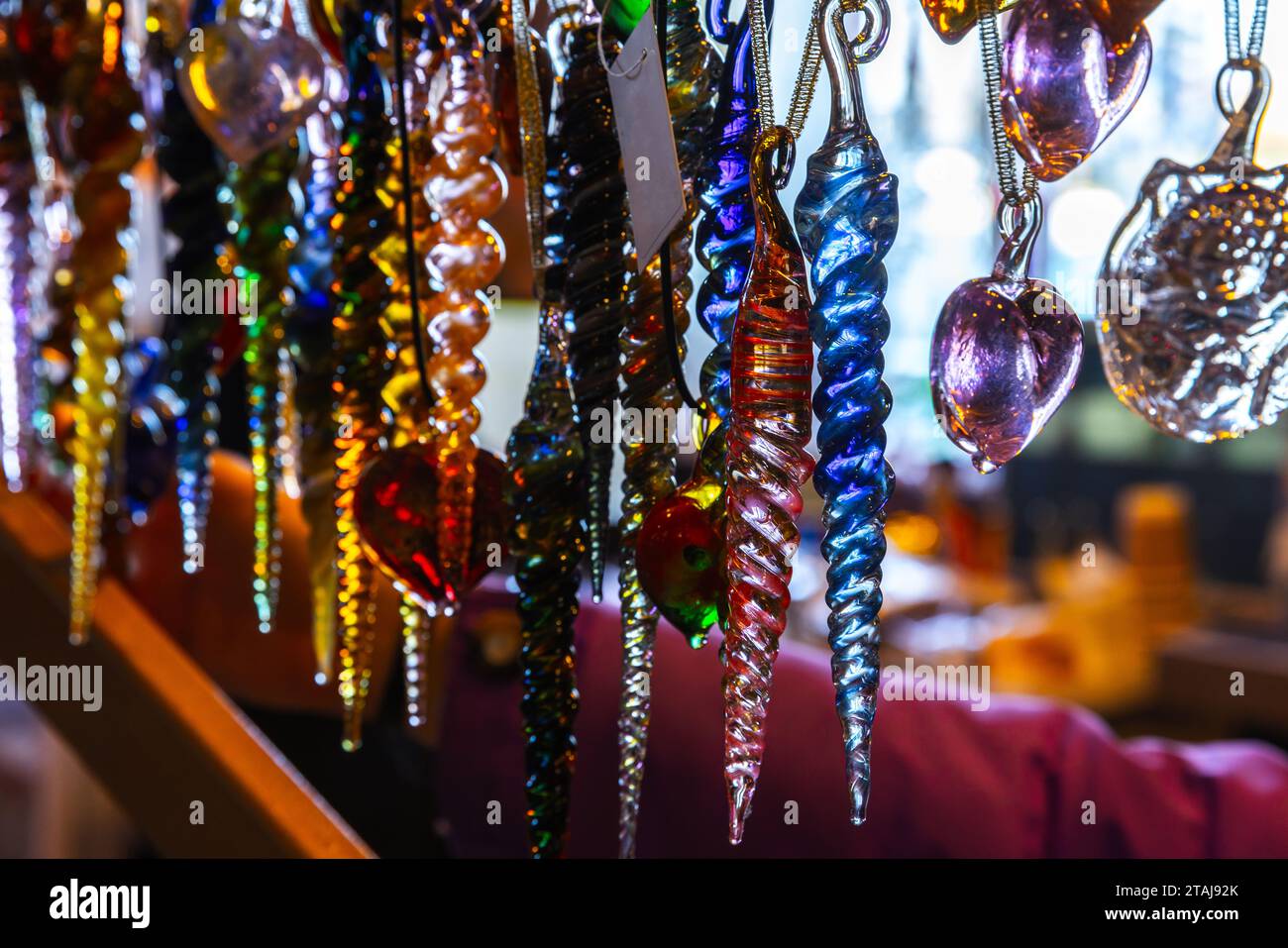 Colorful glass icicles close up photo with selective soft focus, handmade Christmas decoration Stock Photo