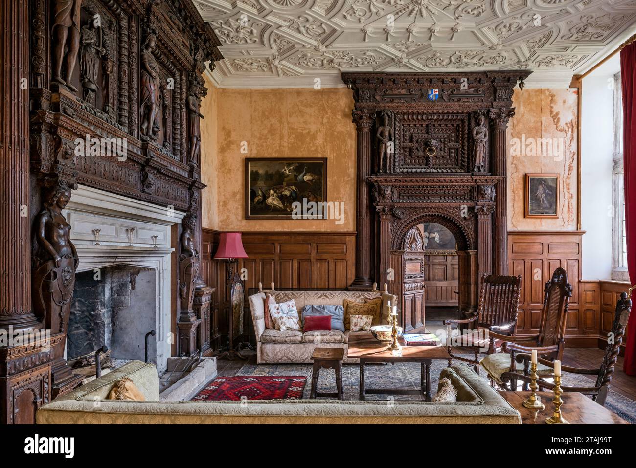 Dramatic carved chimney breast dating c1580s with plasterwork ceiling in drawing room at Wolfeton House, Dorset, England, UK. Stock Photo