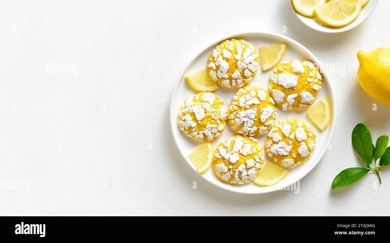Healthy lemon crinkle cookie on plate over white stone background with copy space. Top view, flat lay Stock Photo